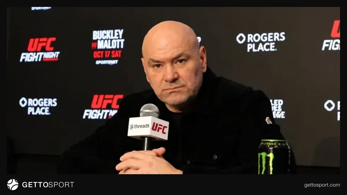 Dana Uayt mətbuat konfransında danışır, arxa planda UFC loqosu