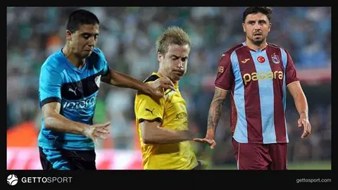 Ozan Tufan maç sırasında takım elbisesi veya formasını giyerken saha kenarında
